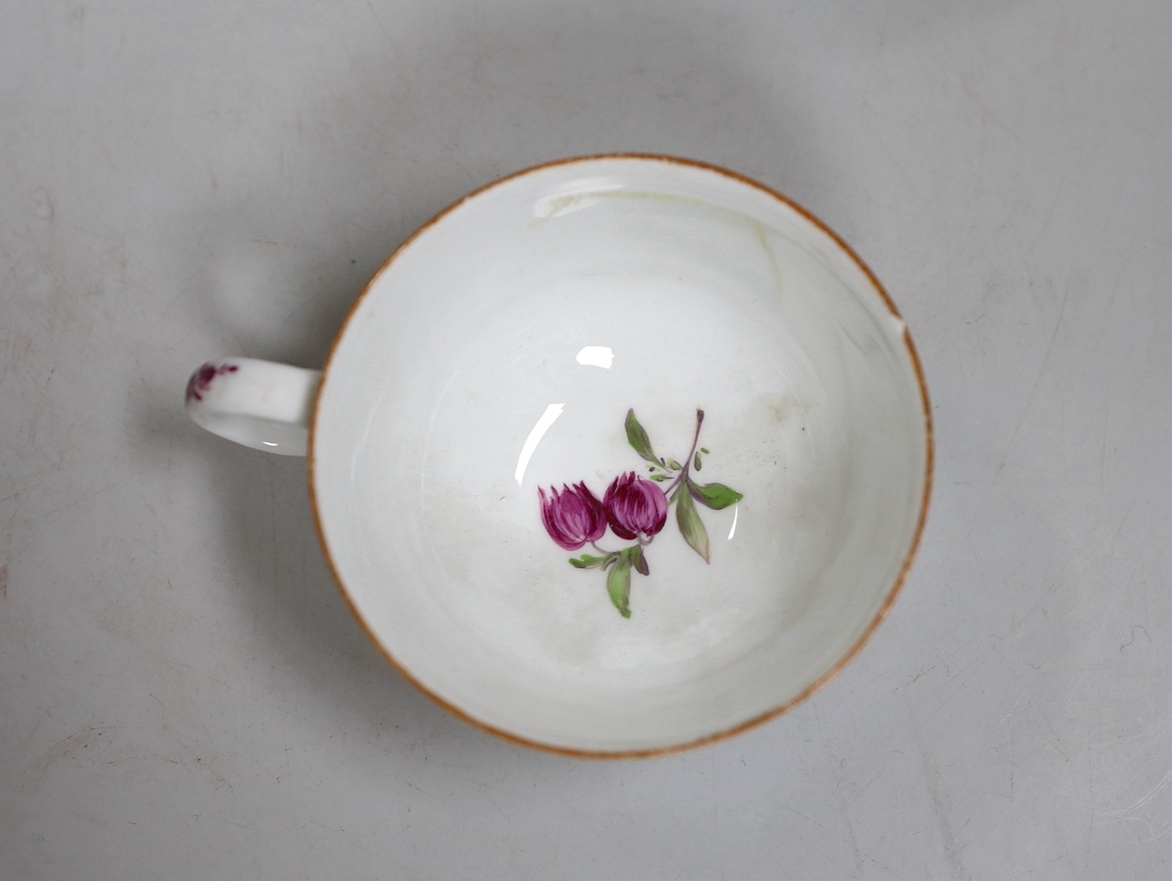 A Meissen dot period flower painted cup and saucer, c.1770
